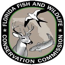 The logo of the FL Fish & Wildlife Conservation Commission: has a deer, bird, and fish in the center with the words of the commission name around the logo.