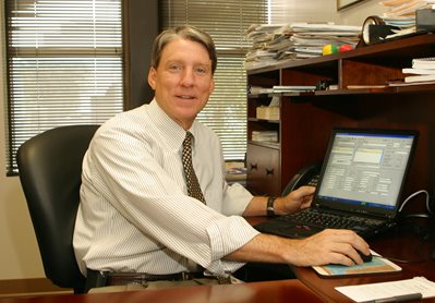 Jim Overton at desk